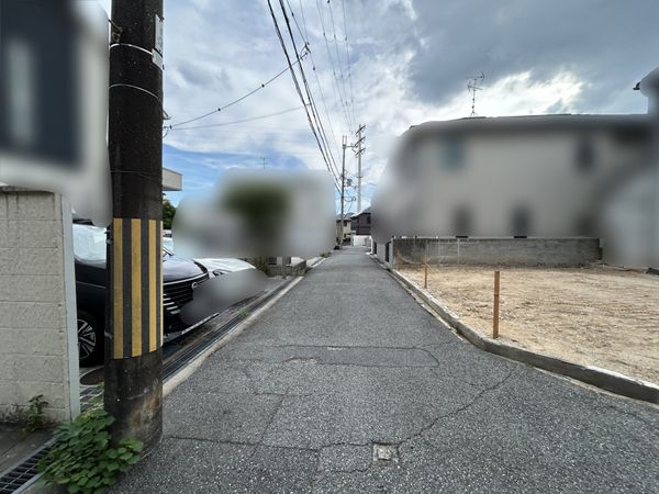 富松町4丁目 新築戸建 前面道路含む外観 富松町4丁目 新築戸建 前面道路含む外観