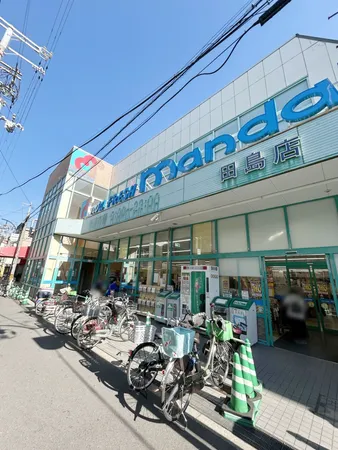 万代田島店　約550ｍ(徒歩約7分)