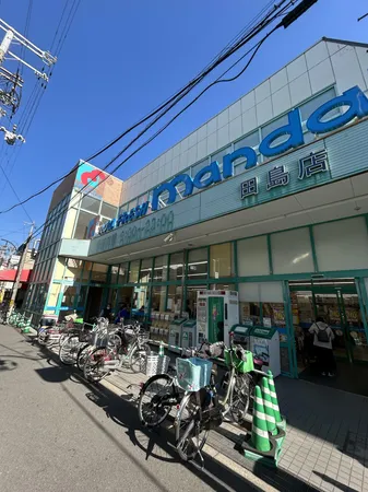 万代田島店　約550ｍ(徒歩約7分)